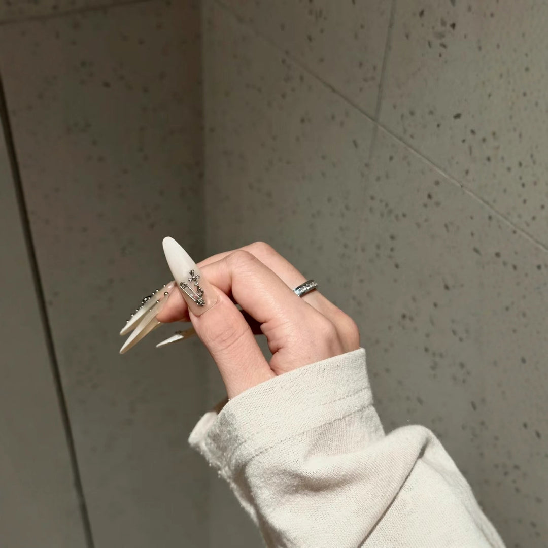 Artistic Stiletto Nail Art Extensions with Decorative Accents
