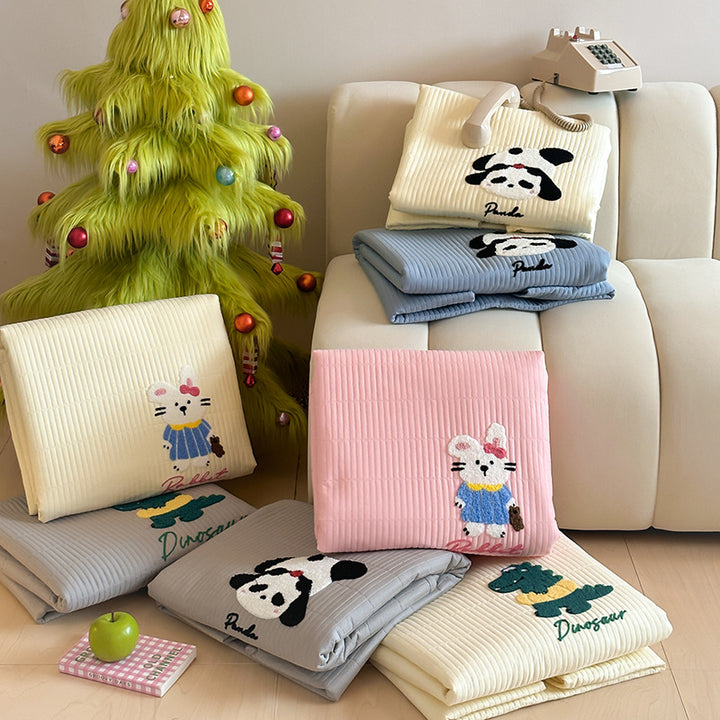 Padded mattress pad with ribbed structure, elastic fitted edge, and panda embroidery