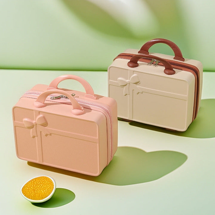 structured hard-shell cosmetic travel case with embossed bow and dual top handles Stornfield