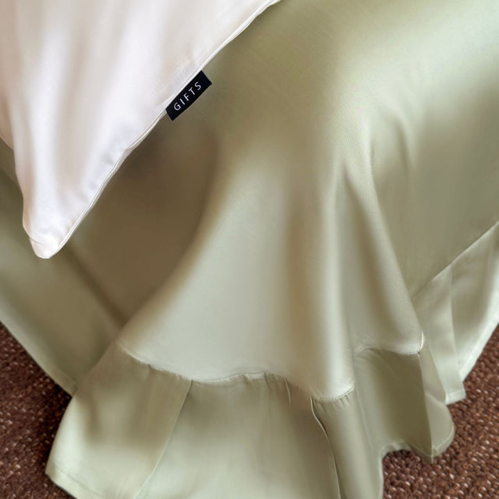 Luxurious satin bedding with floral embroidery and bow closure