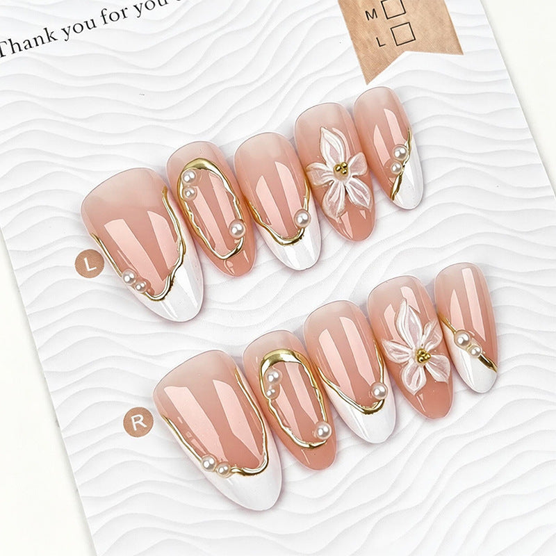 Artistic nail tips with elegant pearl design Stornfield