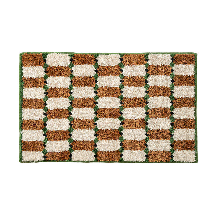 Hand-tufted bathroom mat with a velvety pile, non-slip latex backing, and geometric honeycomb check pattern Stornfield