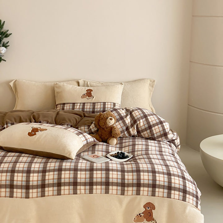 Checked bedding set with embroidered teddy bear appliqués and soft microfiber topper