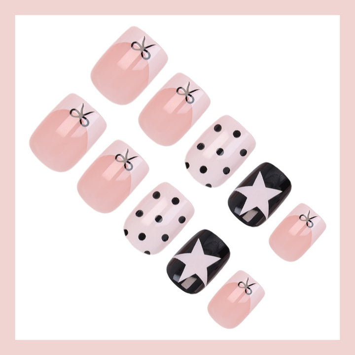 Acrylic nail set with playful dots and star motifs Stornfield