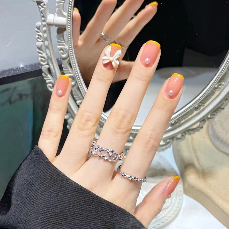 Art nails with elegant 3D flowers and glitter accents Stornfield