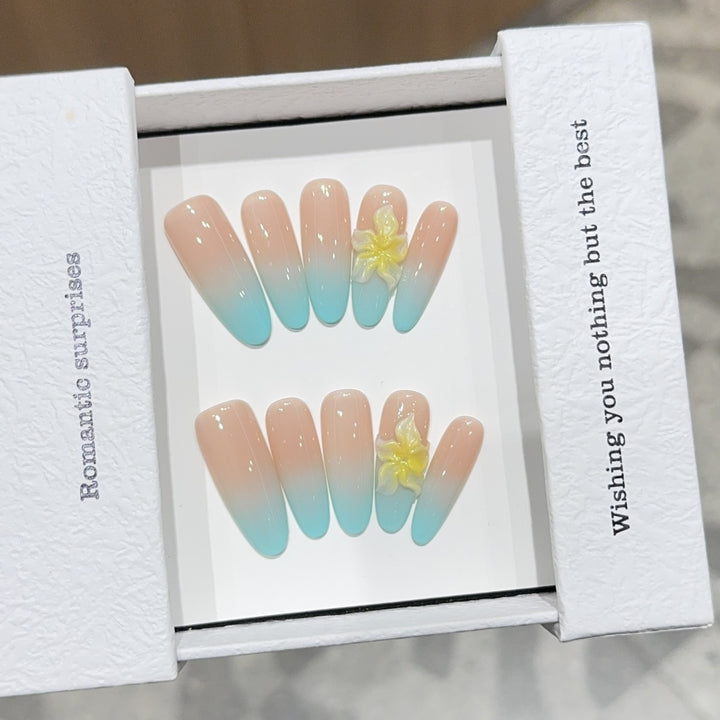 Artificial nails with enchanting ombre effect and floral accents Stornfield