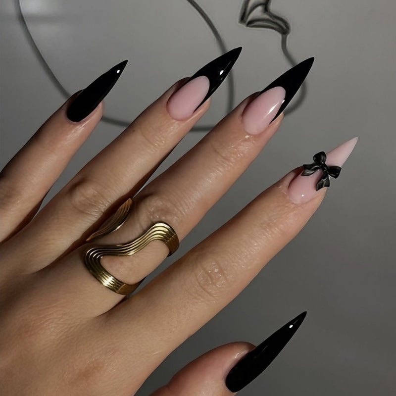 Acrylic nail set with elegant black-and-white design and playful accents Stornfield