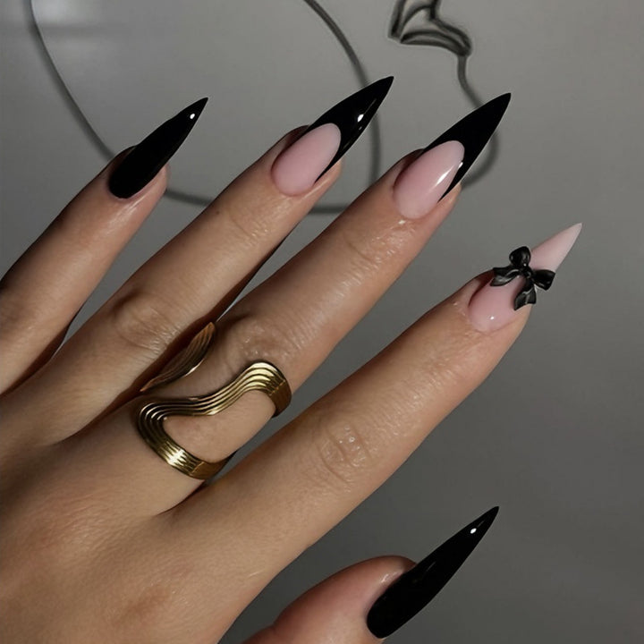 Acrylic nail set with elegant black-and-white design and playful accents Stornfield