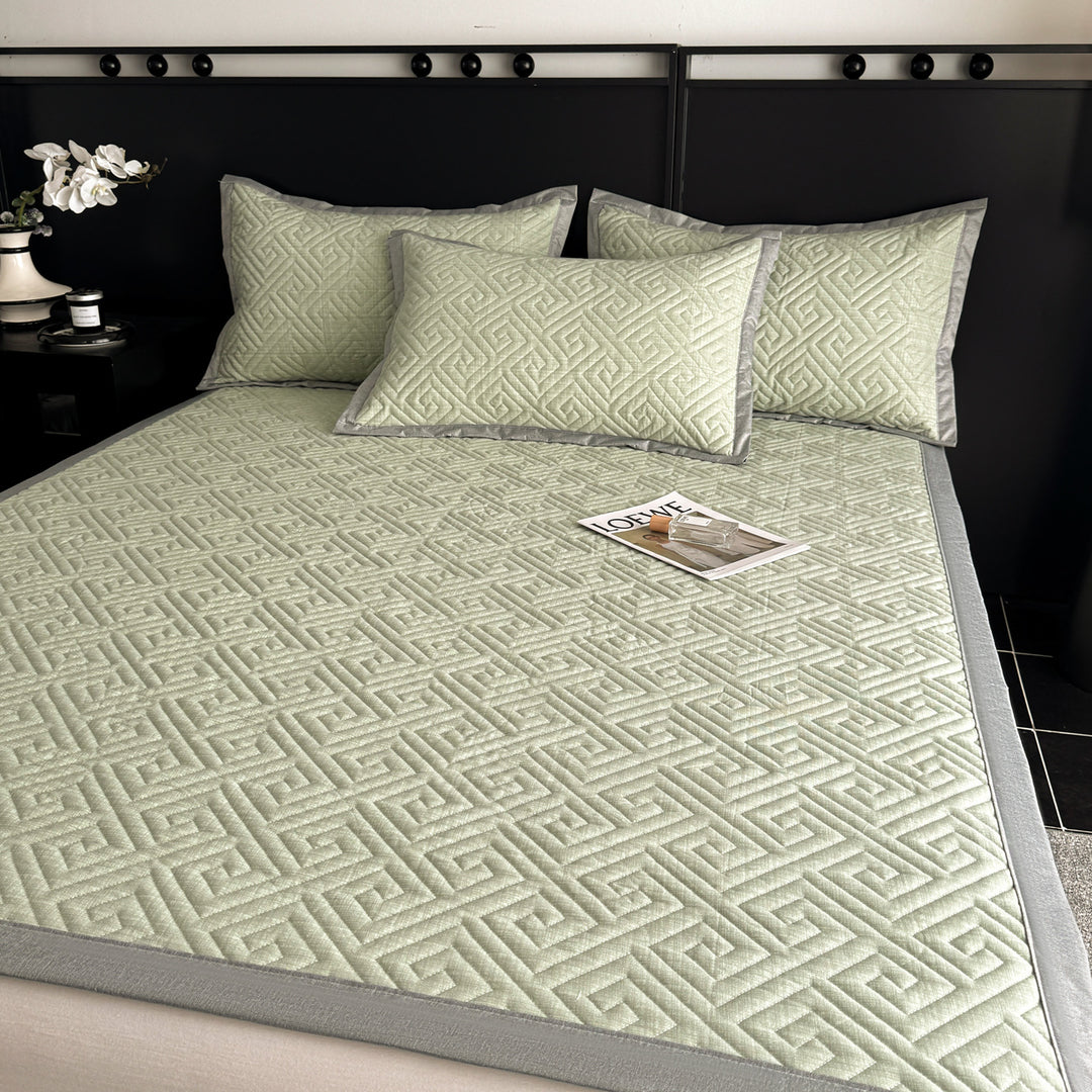 Quilted bedspread and pillow set with geometric striped quilting
