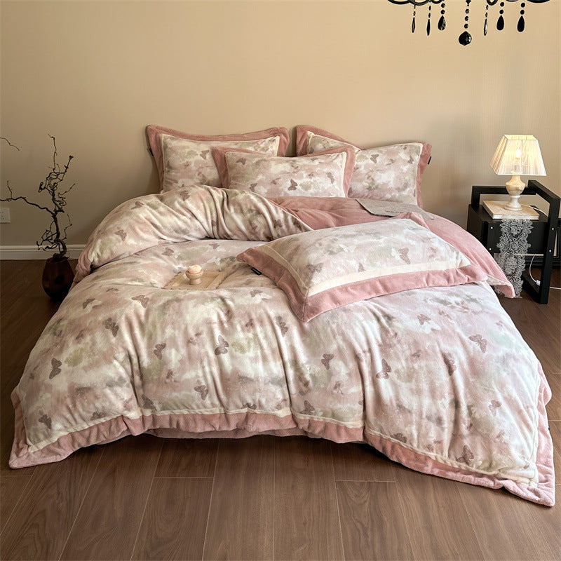 Luxurious quilted bedding set with velvet trim and floral branch motif