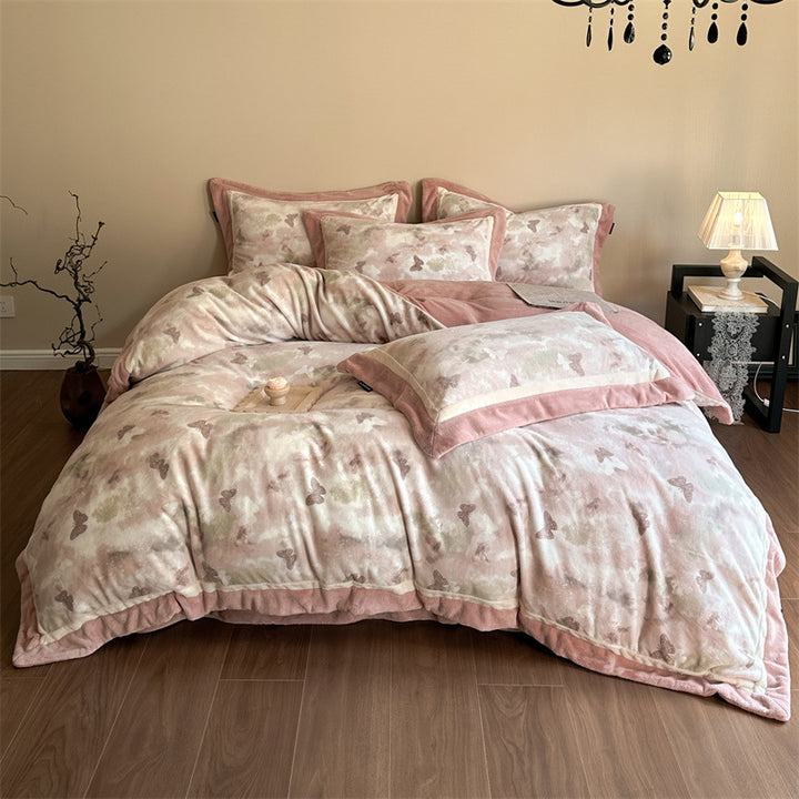 Luxurious quilted bedding set with velvet trim and floral branch motif