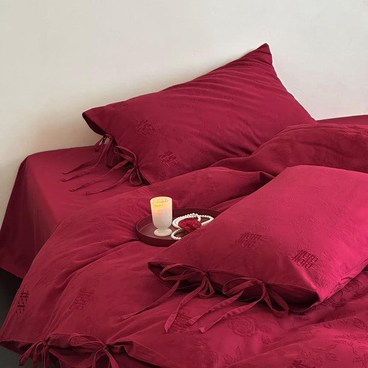 Luxurious cotton satin bedding set with decorative ribbons and jacquard texture