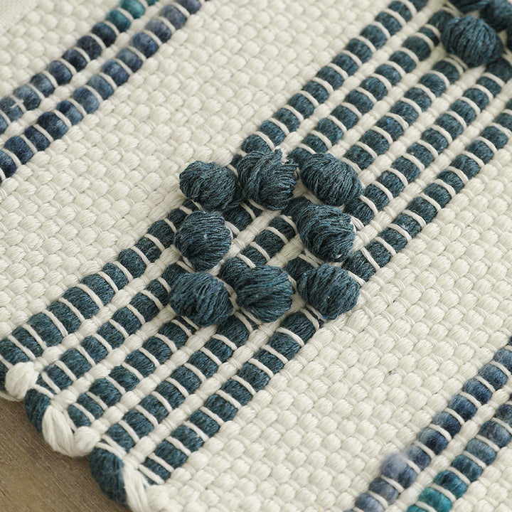 Woven cotton table runner with fringes and textured pattern Stornfield