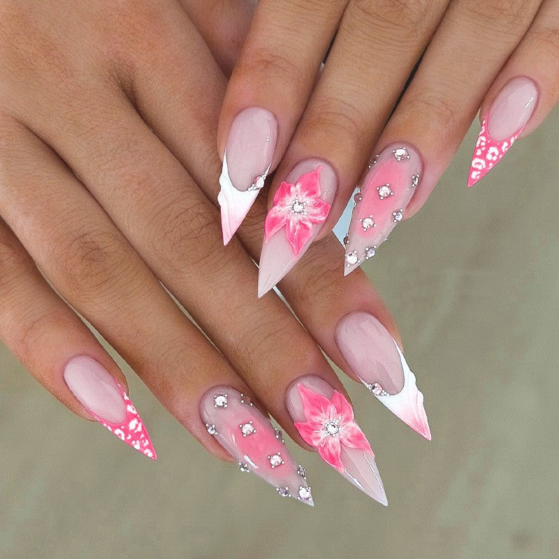 Nail art set with elegant floral embellishments and glamorous accents Stornfield