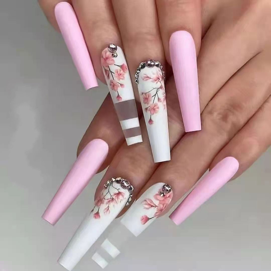 Artificial nails with floral embellishments Stornfield
