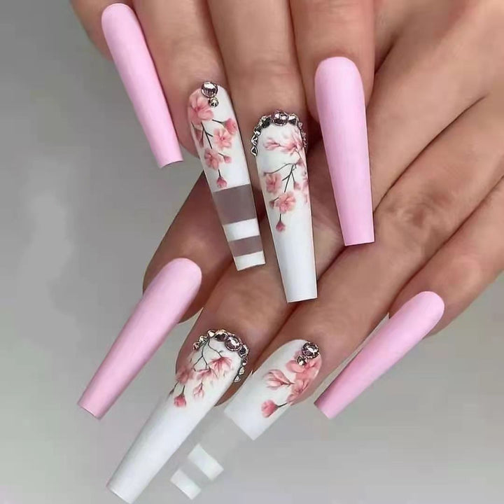 Artificial nails with floral embellishments Stornfield