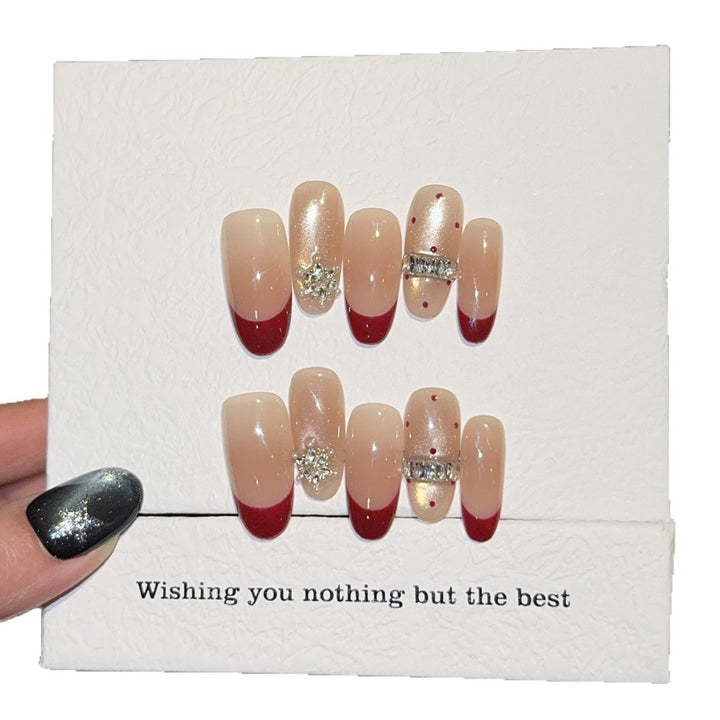 Artificial nails with festive design and rhinestone details Stornfield