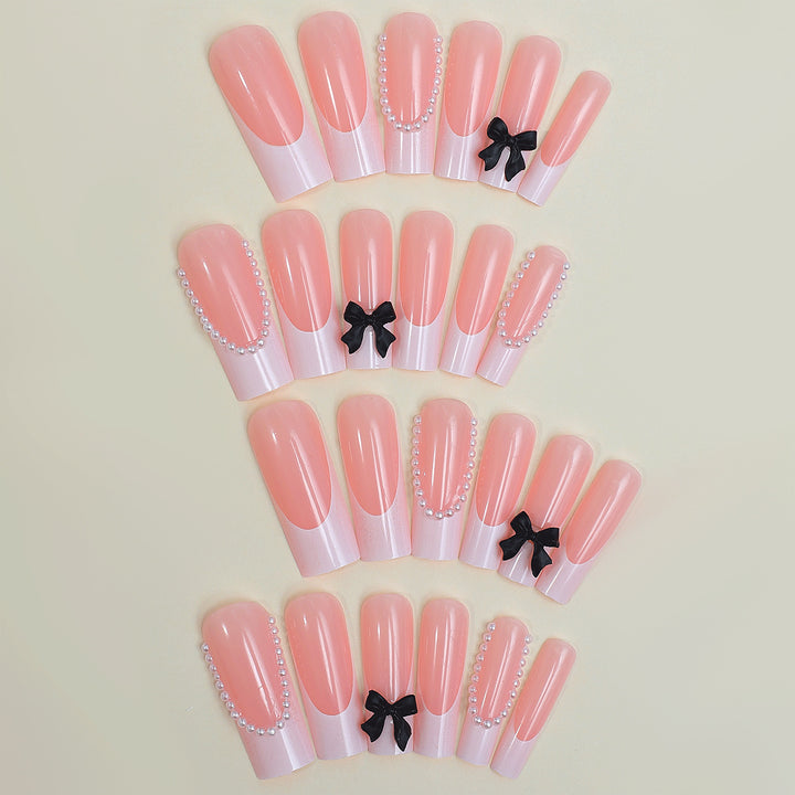 Artificial nail set with elegant rhinestone and bow decorations Stornfield