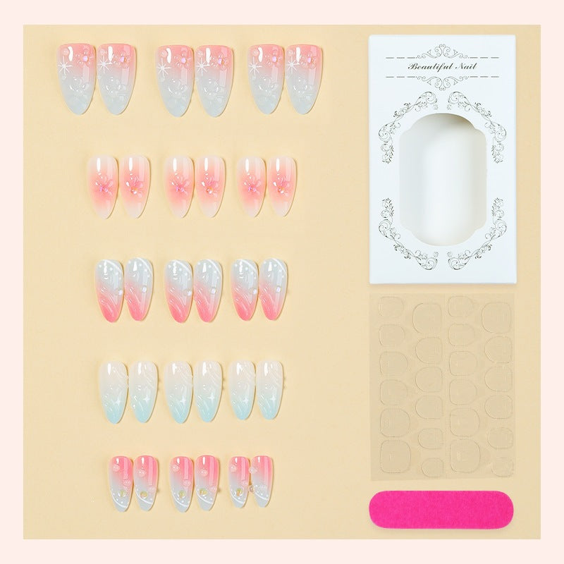 Acrylic nail set with elegant ombre design and floral decorations Stornfield