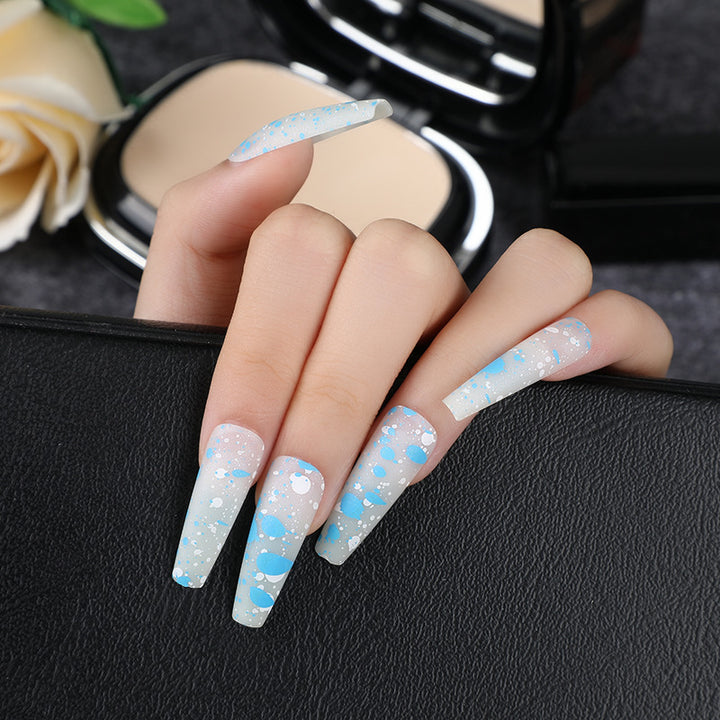 Artistic splatter design artificial nails Stornfield