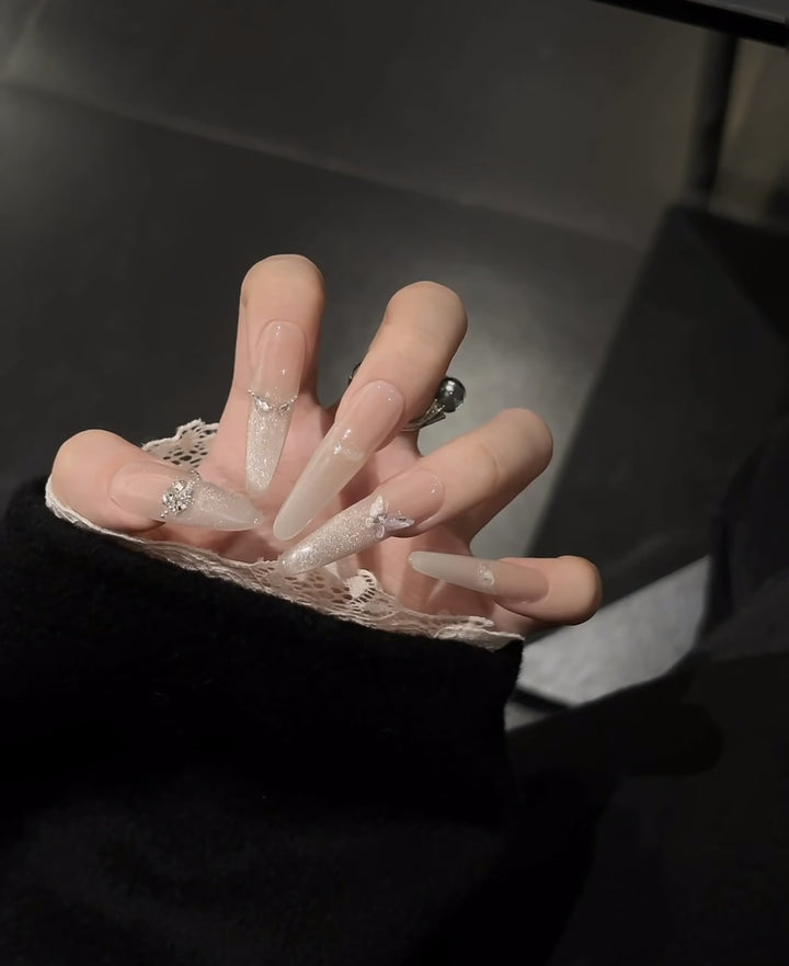 Glamorous Stiletto Nail Extensions with Rhinestone Accents