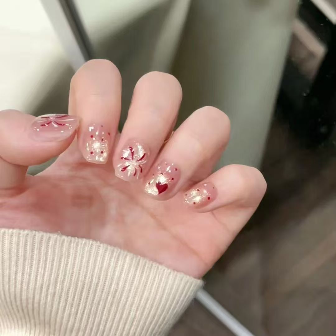 Artificial nails with romantic heart design and glitter coating Stornfield