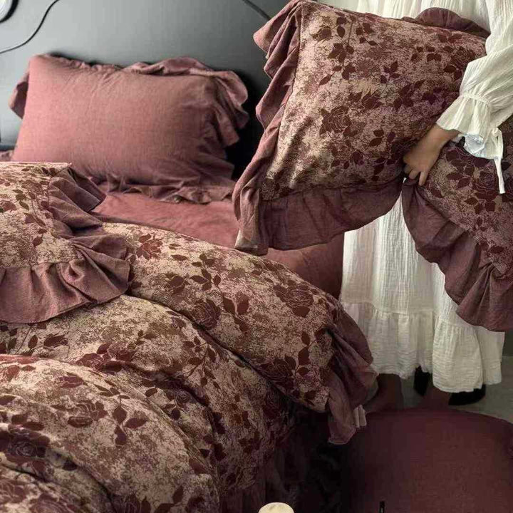 Quilted bed set in vintage look made from cotton blend with velvety floral pattern appearance and ruffle
