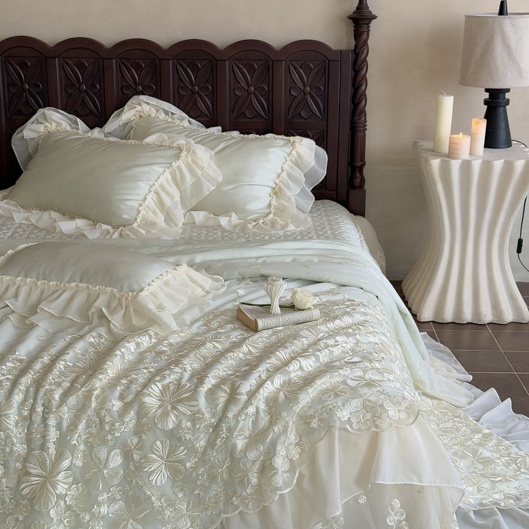 Elegant satin bedding set with double-layer chiffon ruffle and floral relief embroidery