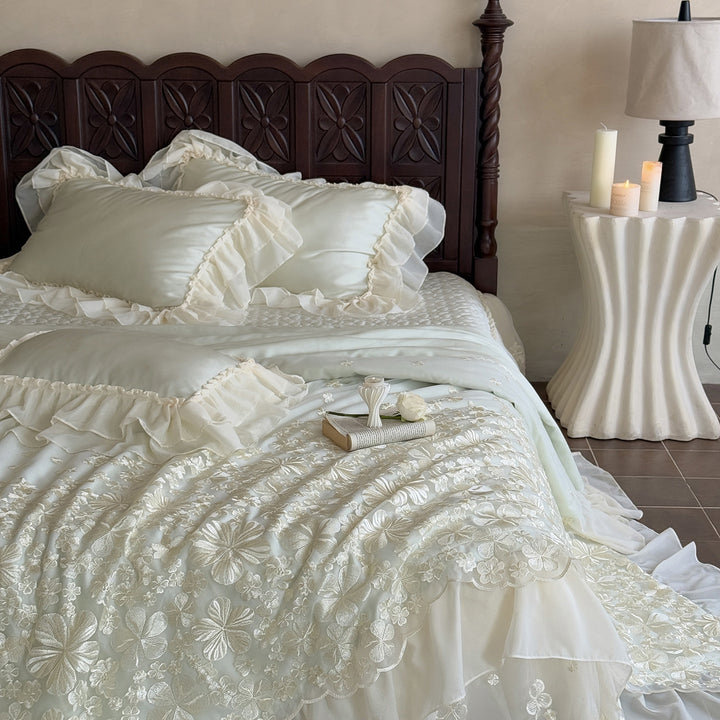 Elegant satin bedding set with double-layer chiffon ruffle and floral relief embroidery