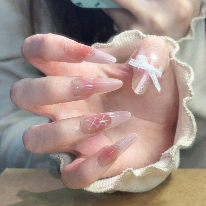 Artificial nails with elegant playful design
