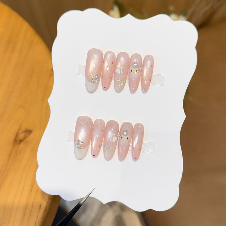 Artificial nail tips with playful penguin and paw print design Stornfield