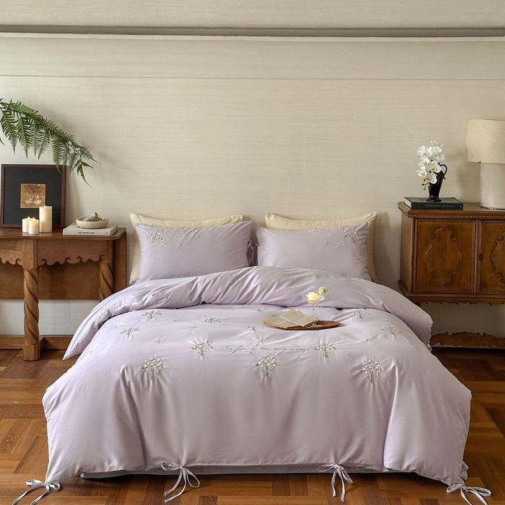 Luxurious satin bedding set with delicate pearl flower embroidery and tie ribbons