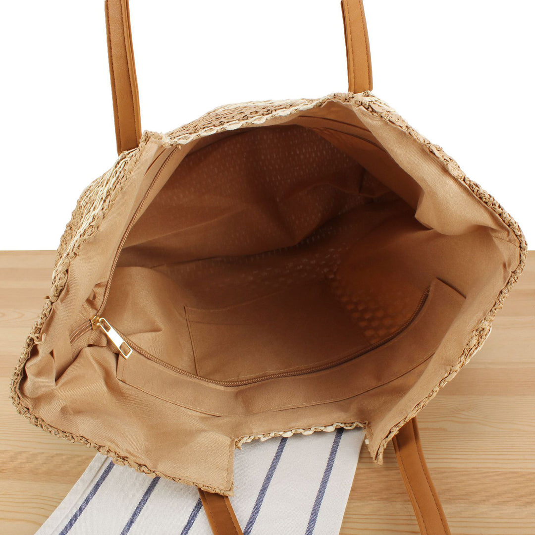 Shopping bag made of woven natural material with elegant leather handles Stornfield