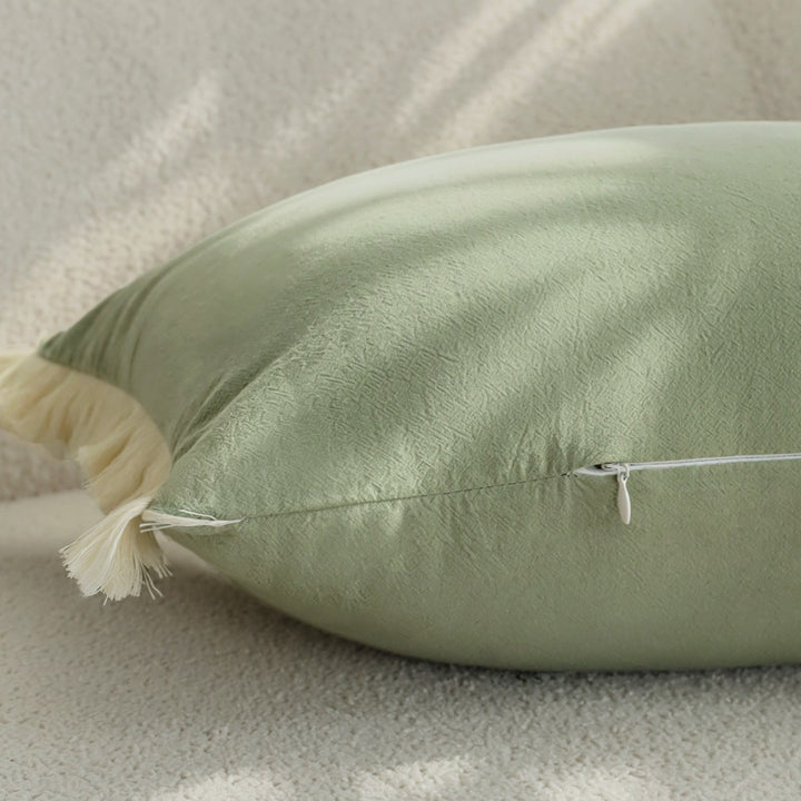 Long decorative cushion with fringe edge