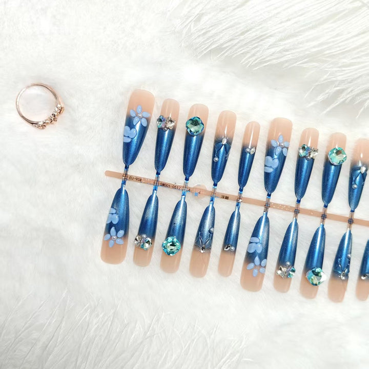 Elegant artificial nails with floral applications and glitter elements Stornfield