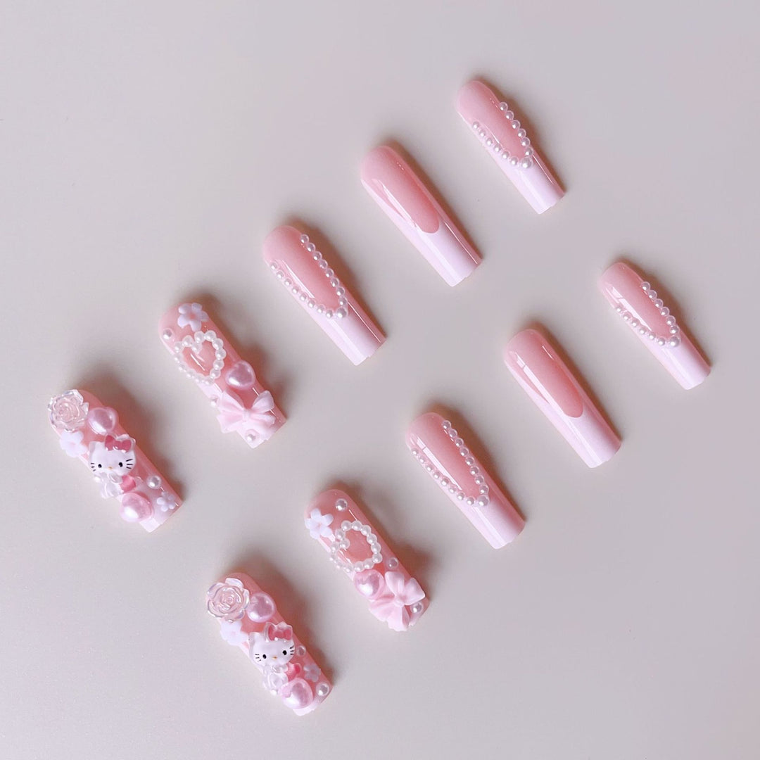Acrylic nail set with playful 3D accents and pearl details Stornfield