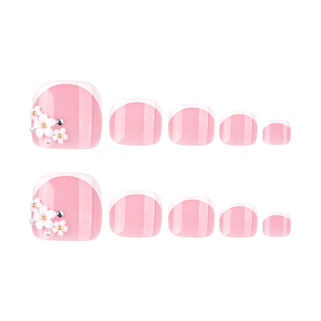Artful toenail design with delicate flower and French tip accents Stornfield