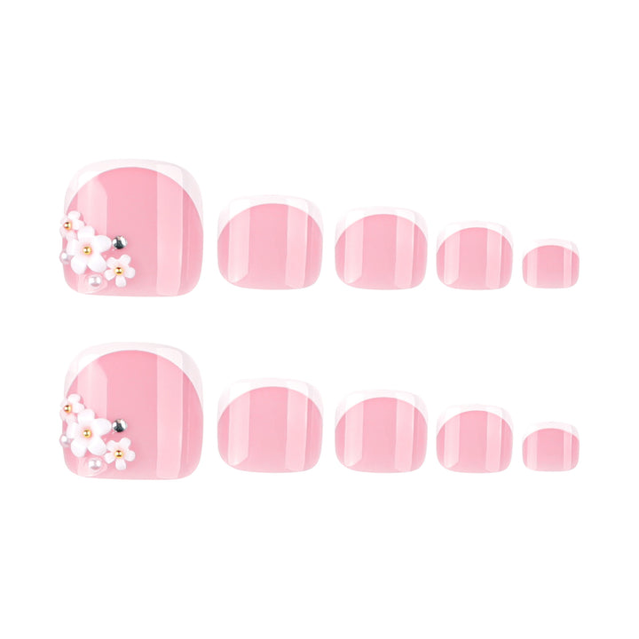 Artful toenail design with delicate flower and French tip accents Stornfield