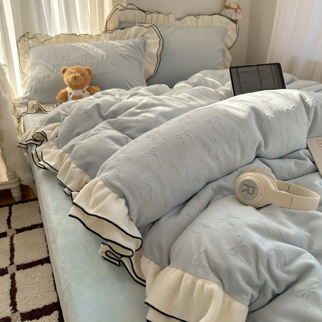 Cozy quilted bedding set with relief ribbon embroidery and contrasting ruffle edge