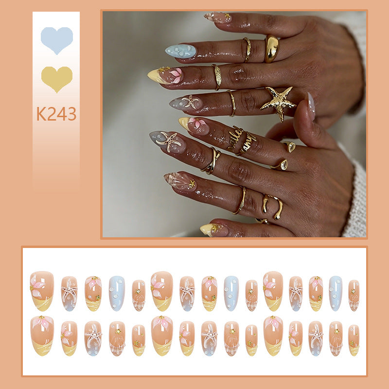 Artificial nail set with floral motifs and glitter accents Stornfield