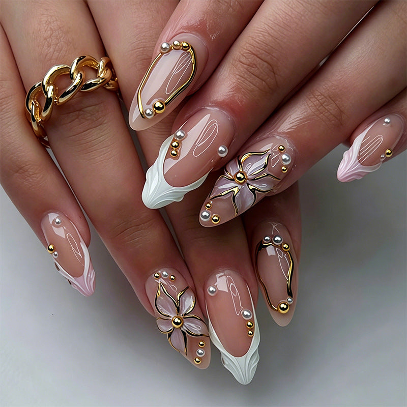 Artificial nail set with elegant floral designs and glamorous 3D applications Stornfield