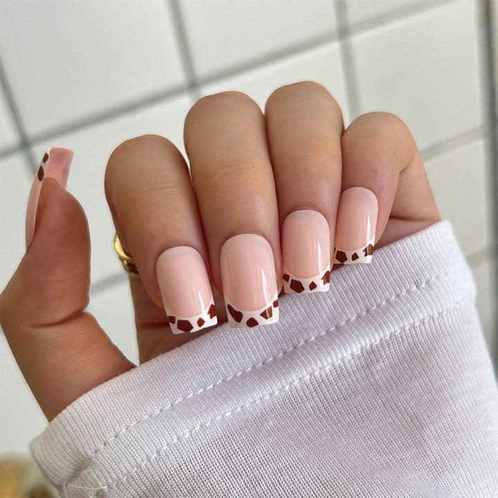 Artful nail extensions with an elegant leaf pattern Stornfield
