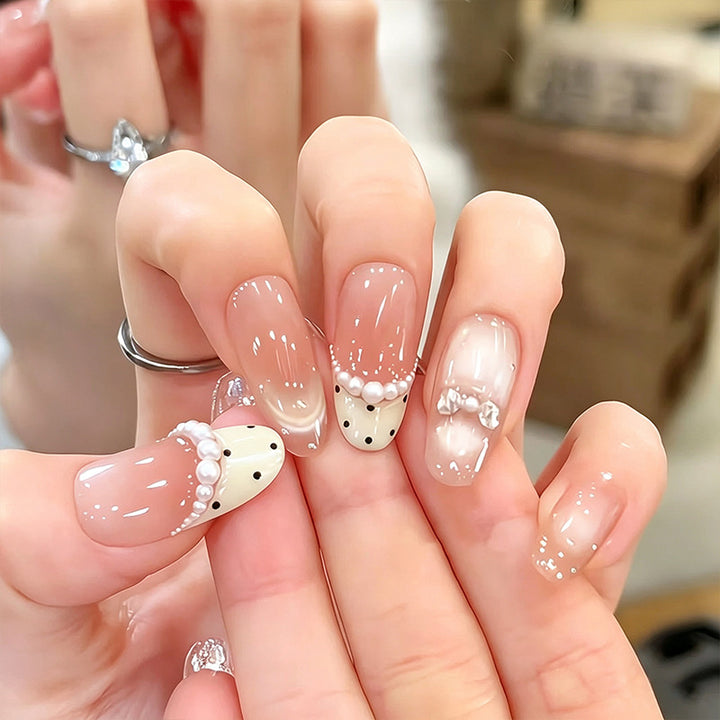 Artificial nail set with elegant French design and delicate pearl embellishments Stornfield