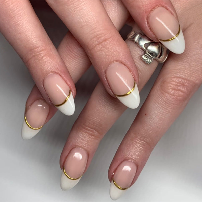 Artistic French-Tip Nails with Gold Accents Stornfield