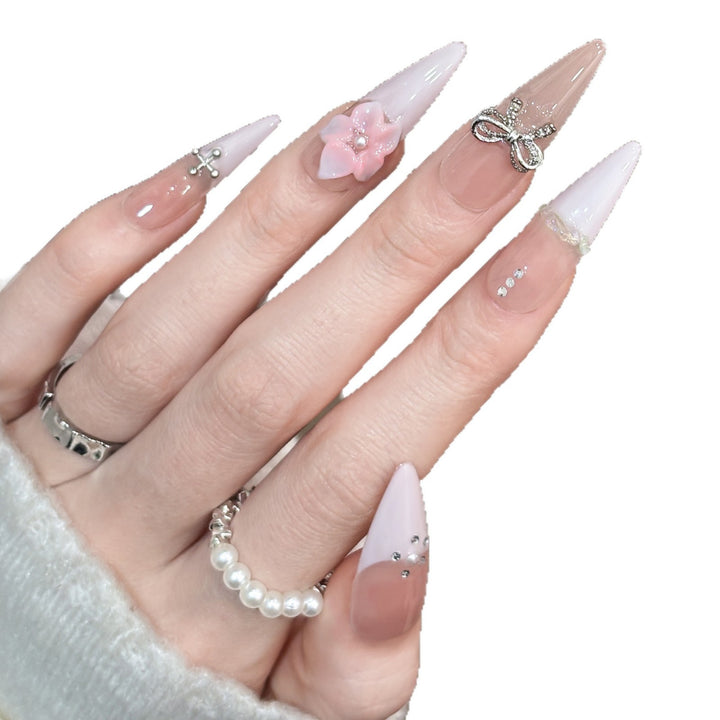 Decorative Stiletto Press-On Nails with Floral Accents and Gem Details