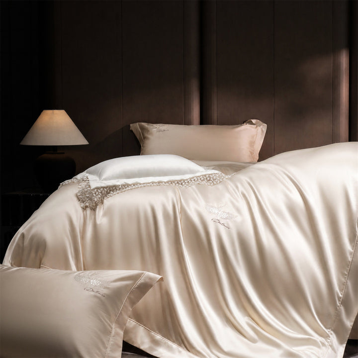 Luxurious satin bedding set with embroidered swan motif and lace pillow