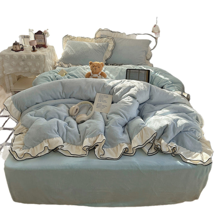 Cozy quilted bedding set with relief ribbon embroidery and contrasting ruffle edge