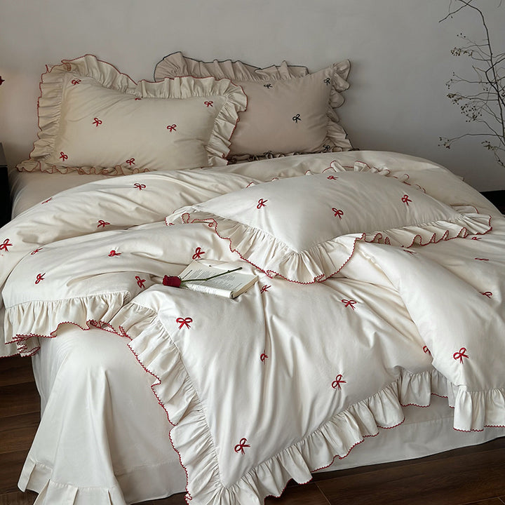 Luxurious bed linen set with ruffles and embroidered bows
