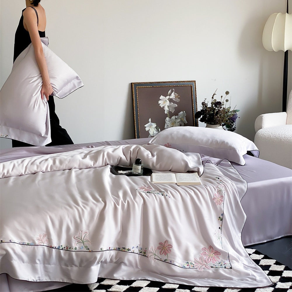Luxurious silk bedding set with embroidered floral design
