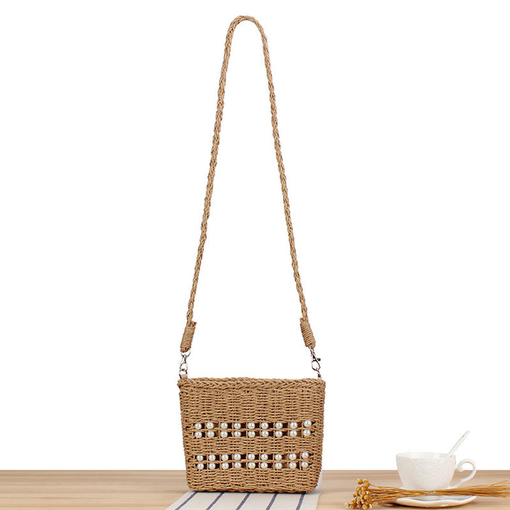 Handbag made of hand-woven natural material with pearl decoration Stornfield